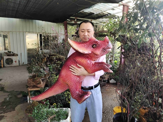 comprar Bebé rojo personalizado muñeco de mano Dino para el parque de diversiones online manufacture